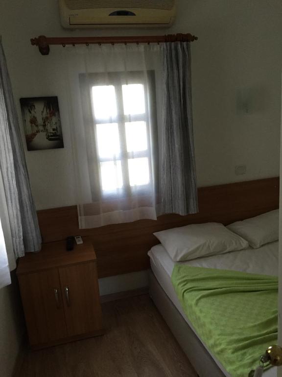 Postel nebo postele na pokoji v ubytování Tay Pansiyon