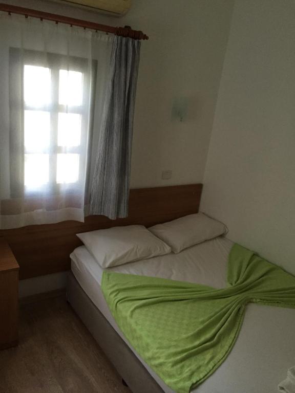 Postel nebo postele na pokoji v ubytování Tay Pansiyon