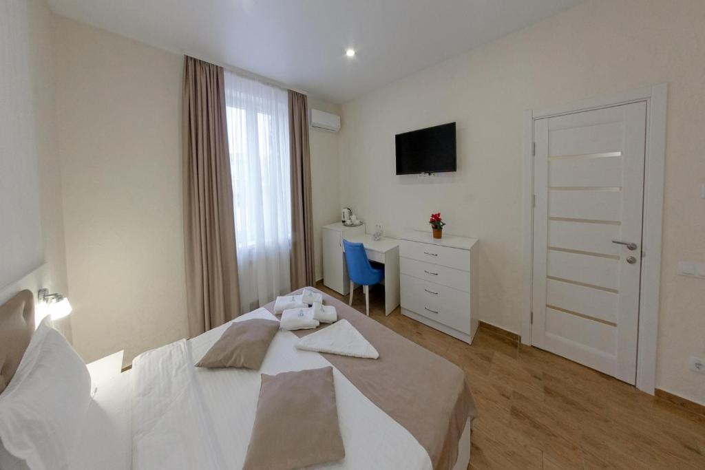 Postel nebo postele na pokoji v ubytování Apart-Hotel Poseidon