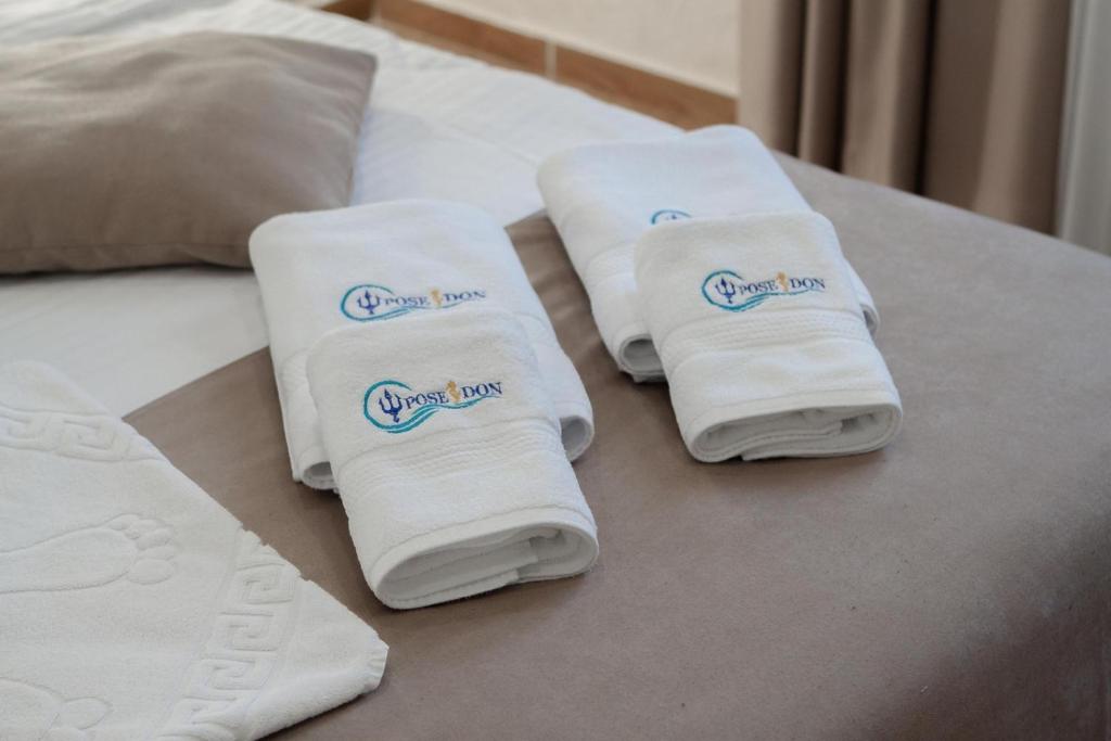 Postel nebo postele na pokoji v ubytování Apart-Hotel Poseidon