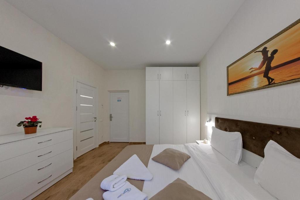 Postel nebo postele na pokoji v ubytování Apart-Hotel Poseidon