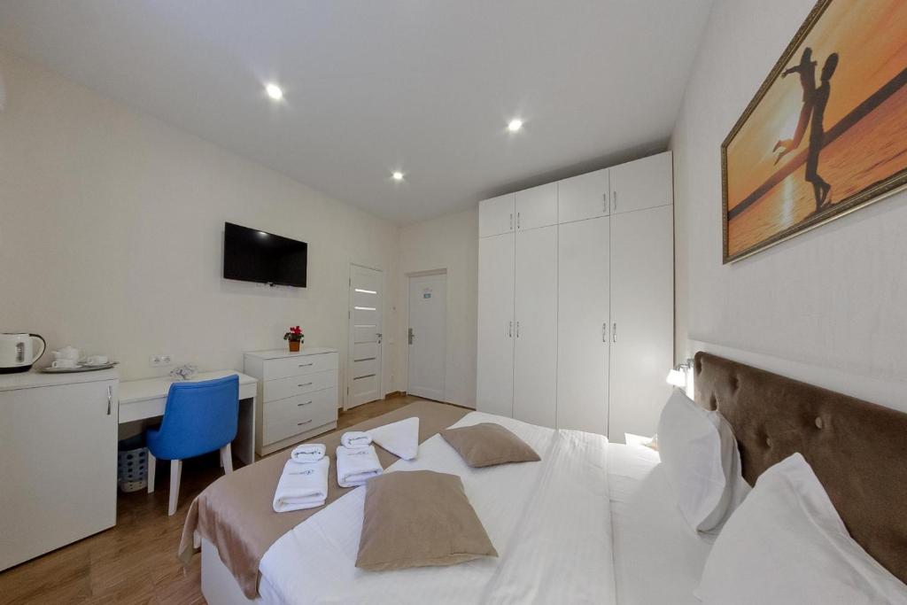 Postel nebo postele na pokoji v ubytování Apart-Hotel Poseidon