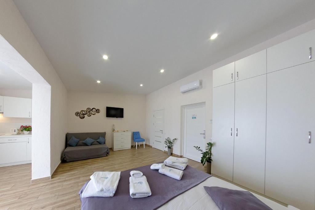 Postel nebo postele na pokoji v ubytování Apart-Hotel Poseidon