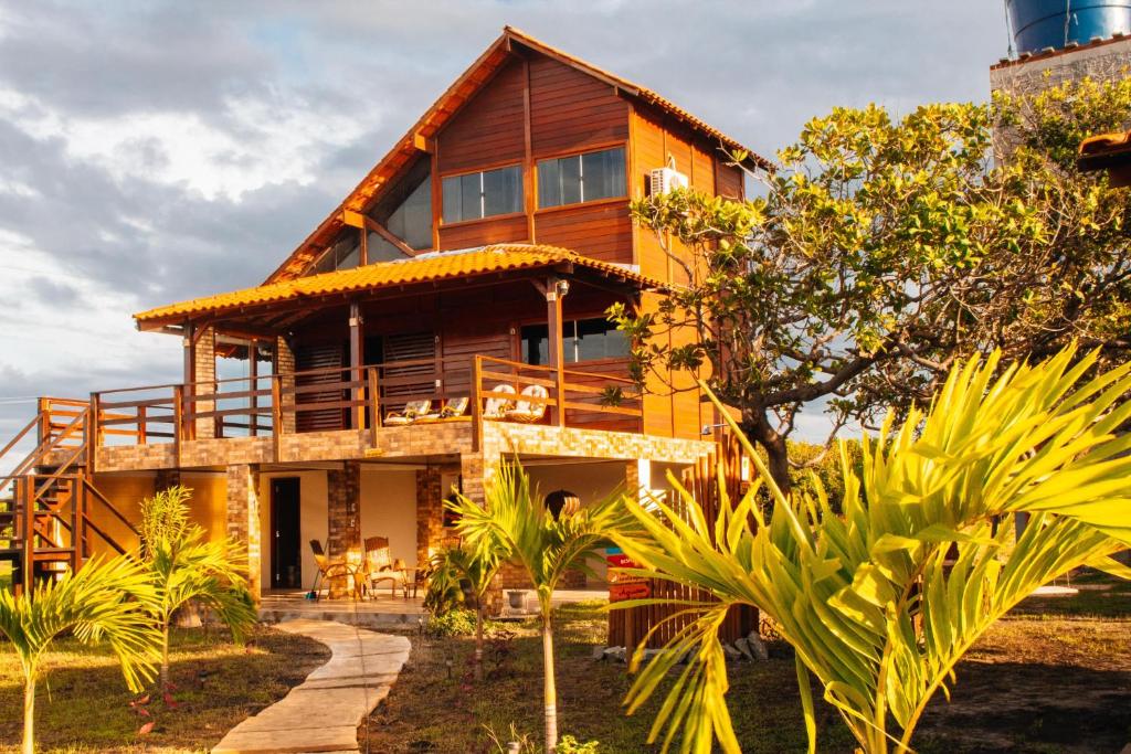 a house with a pathway leading up to it at Pousada Rancho Matos in Santo Amaro