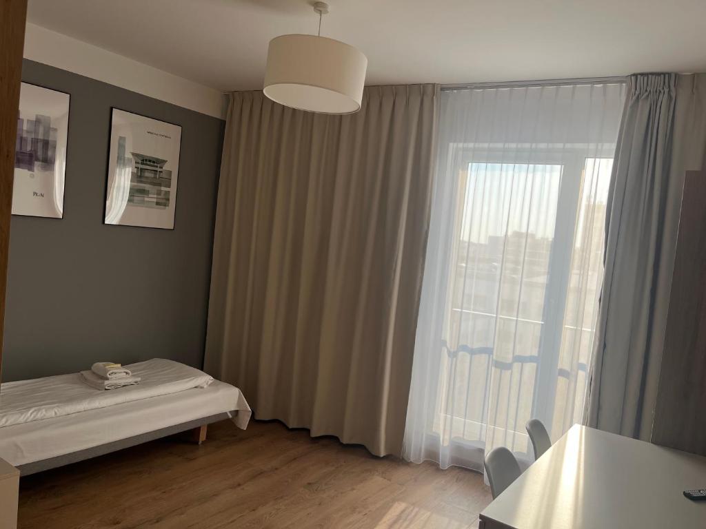 Posteľ alebo postele v izbe v ubytovaní Aparthotel City Break Wolska