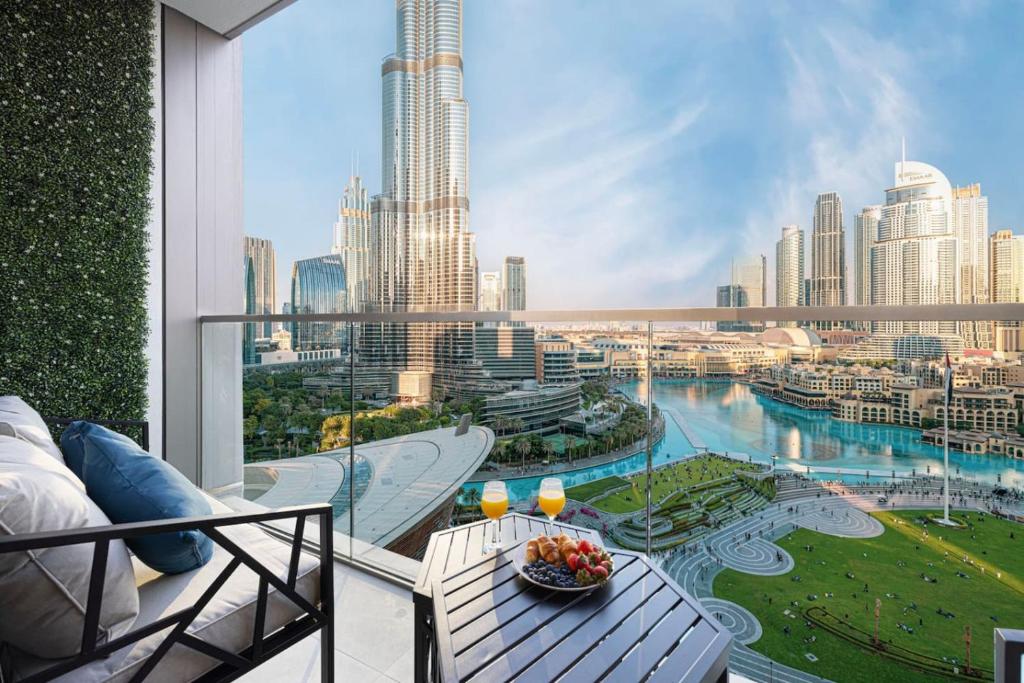 a balcony with a view of a city skyline at NEW YEARS Luxury Burj Khalifa and Fountain Views in Dubai