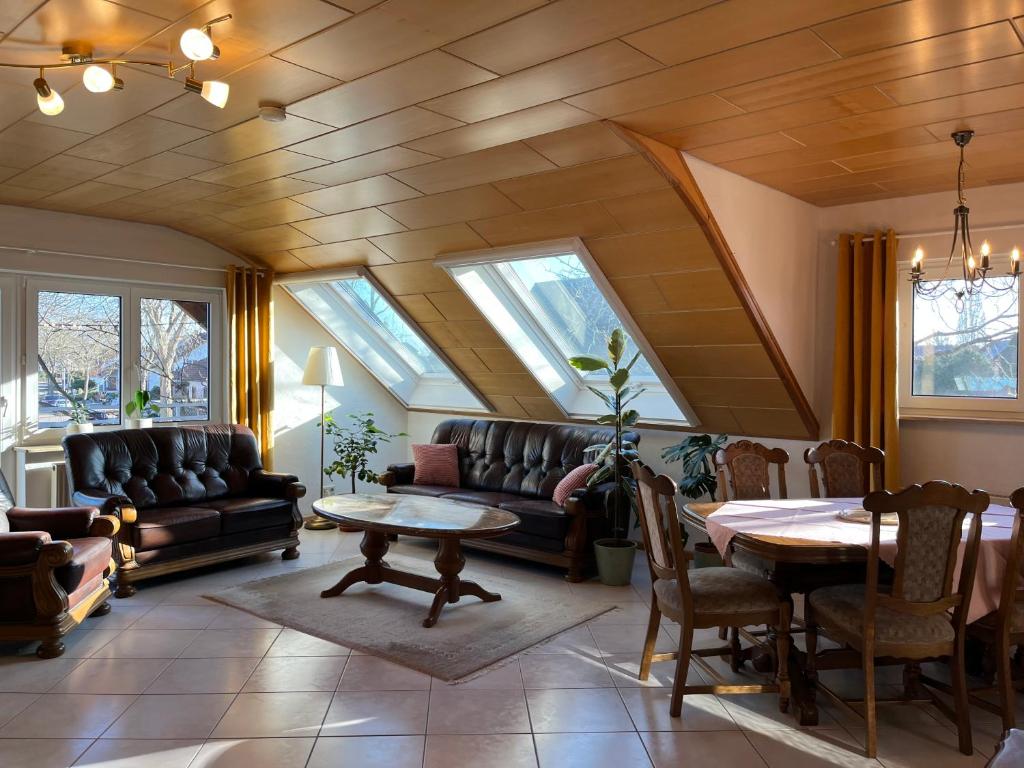 a living room with a couch and a table at Rebstock in Kehl am Rhein