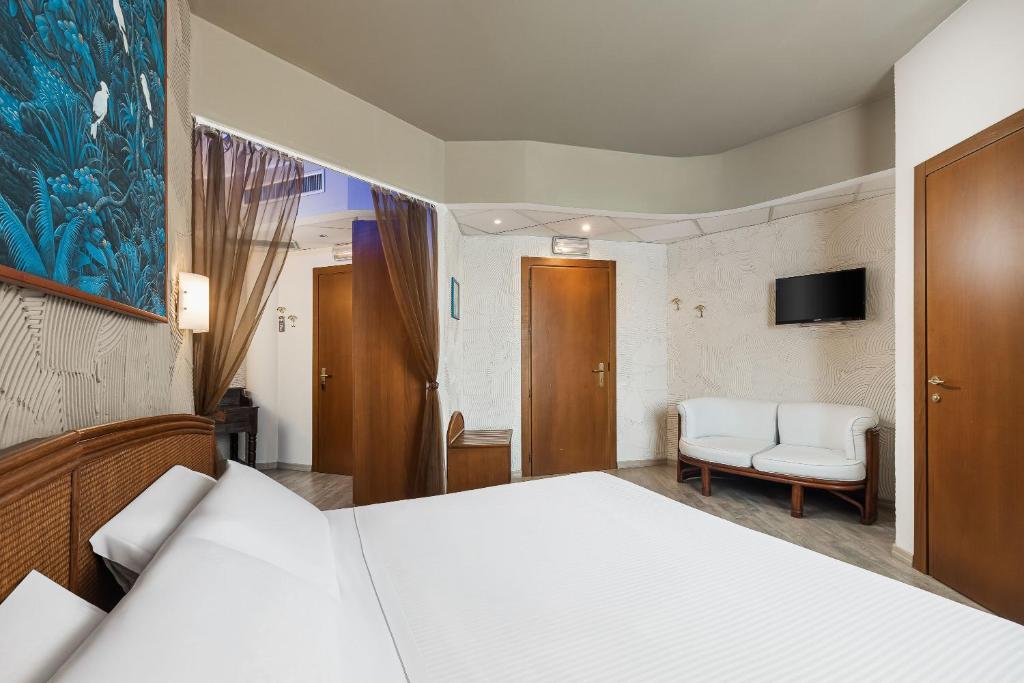 Postel nebo postele na pokoji v ubytování Welcome Hotel
