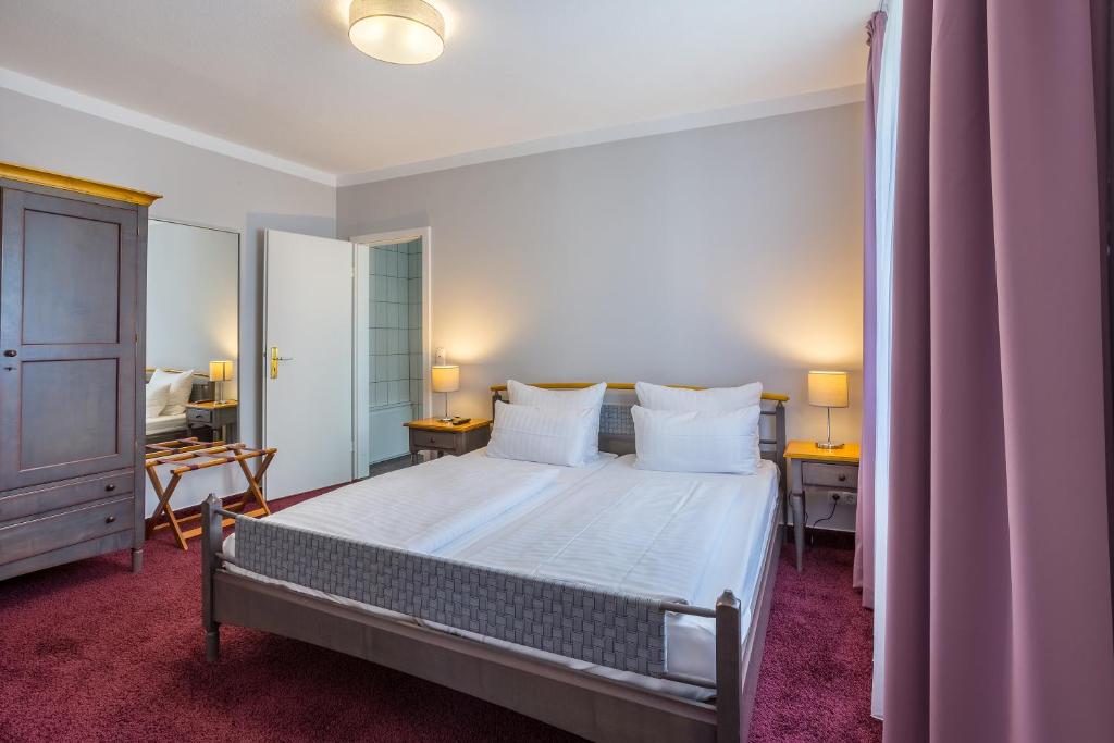 Postel nebo postele na pokoji v ubytování Hotel Annaberg