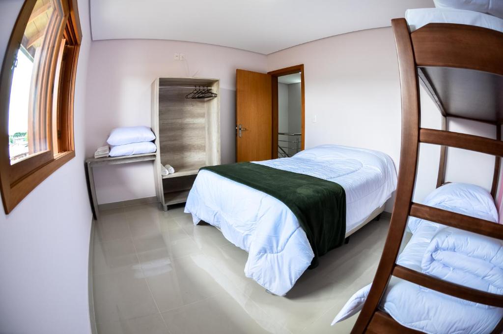 Postel nebo postele na pokoji v ubytování Casas dos Alpes