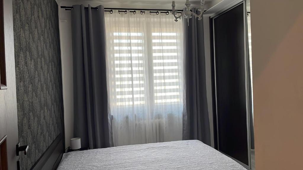 Posteľ alebo postele v izbe v ubytovaní Centrum Apartment Lipowa 12