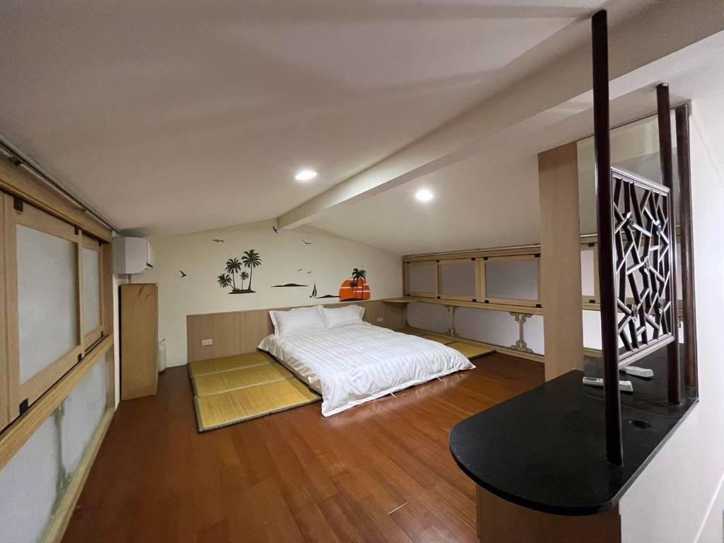 Postel nebo postele na pokoji v ubytování Miaoli Sanyi Travelling Homestay