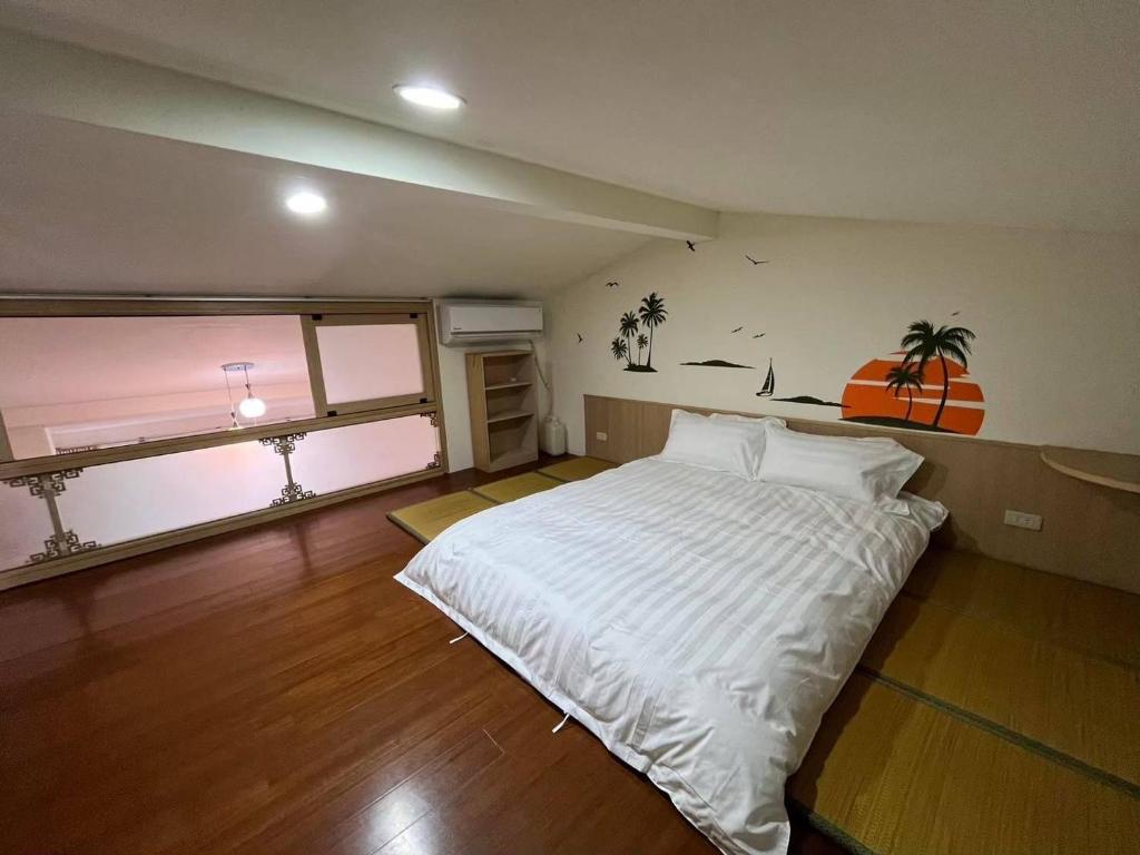 Postel nebo postele na pokoji v ubytování Miaoli Sanyi Travelling Homestay