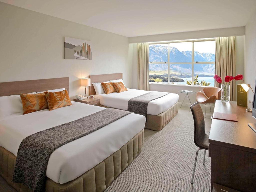 Postel nebo postele na pokoji v ubytování Mercure Queenstown Resort