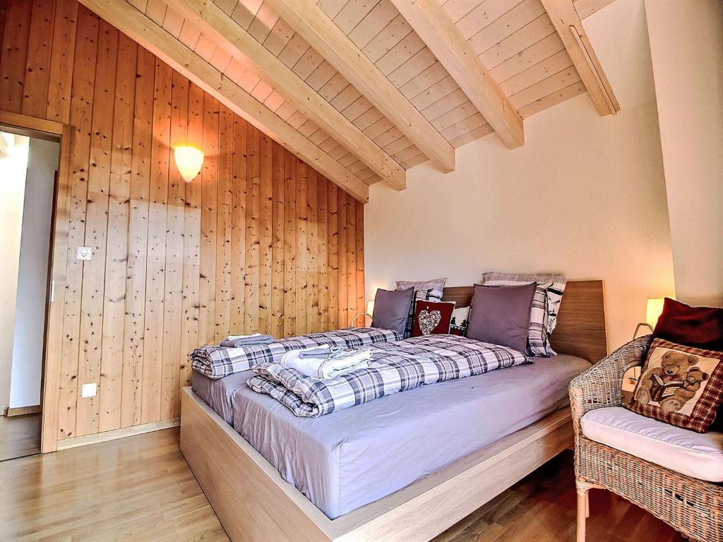 Postel nebo postele na pokoji v ubytování Chalet Dendron by Interhome