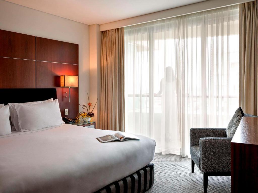 Postel nebo postele na pokoji v ubytování Pullman Auckland Hotel & Apartments