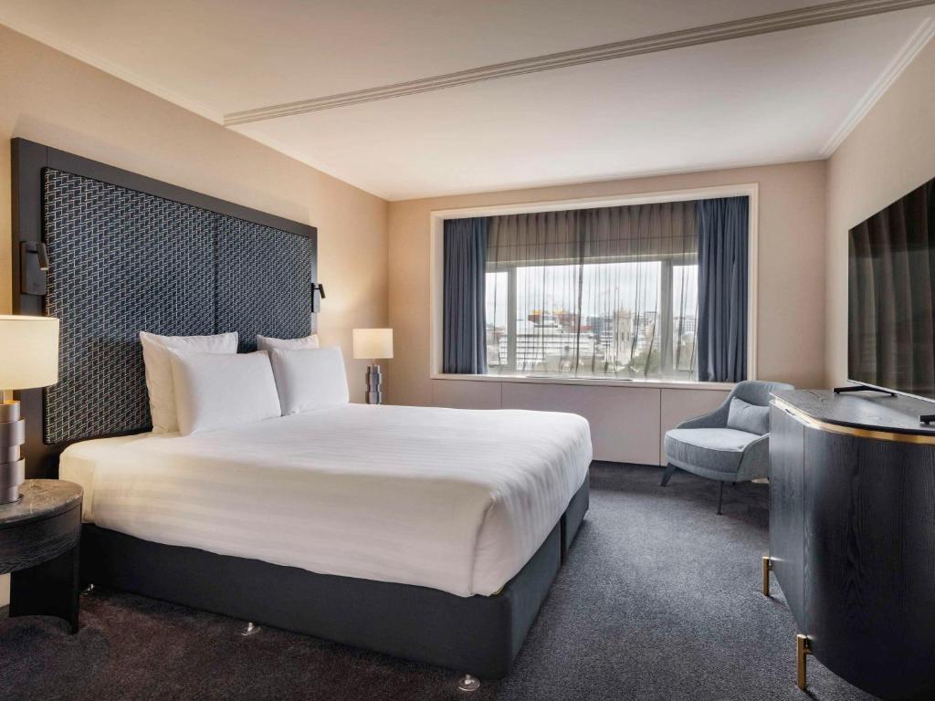 Postel nebo postele na pokoji v ubytování Pullman Auckland Hotel & Apartments