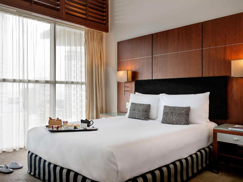 Postel nebo postele na pokoji v ubytování Pullman Auckland Hotel & Apartments