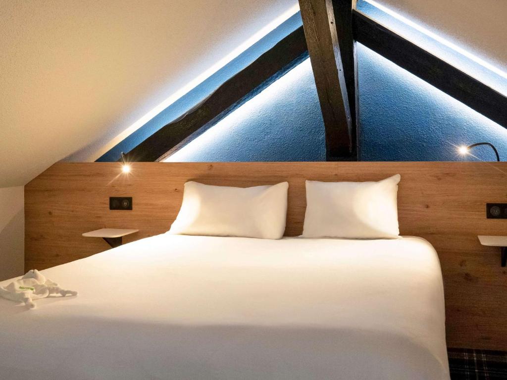 Postel nebo postele na pokoji v ubytování Ibis Styles Colmar Centre