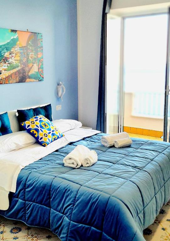 Postel nebo postele na pokoji v ubytování Villa Blu Costiera