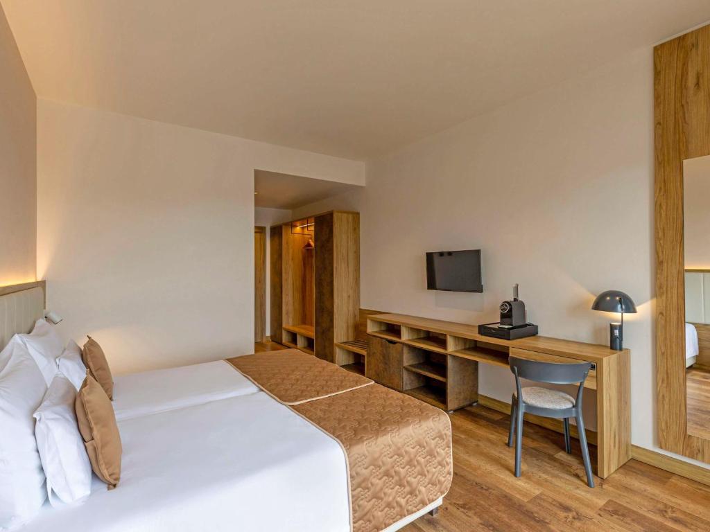 Voodi või voodid majutusasutuse Movenpick Resort and Spa Fruske Terme toas