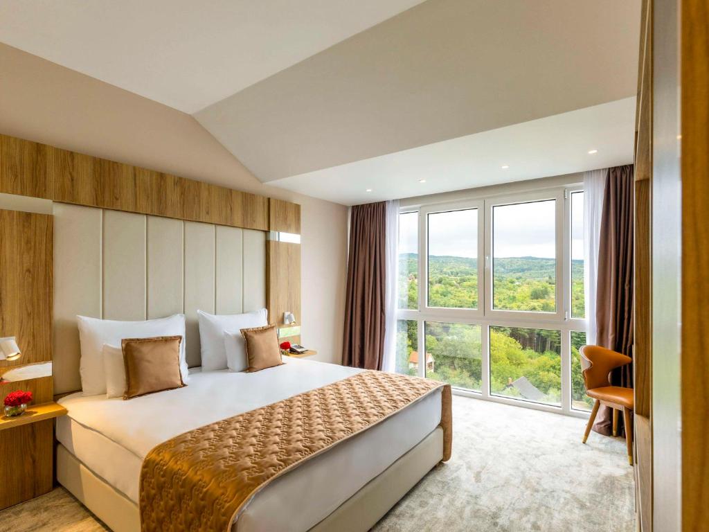 Voodi või voodid majutusasutuse Movenpick Resort and Spa Fruske Terme toas