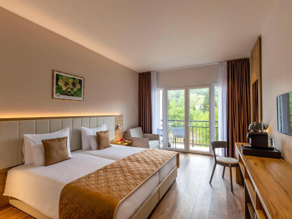 Voodi või voodid majutusasutuse Movenpick Resort and Spa Fruske Terme toas