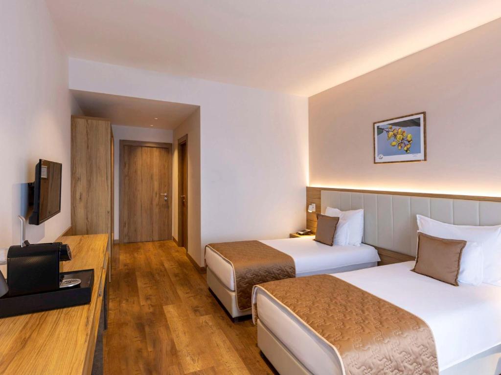 Voodi või voodid majutusasutuse Movenpick Resort and Spa Fruske Terme toas