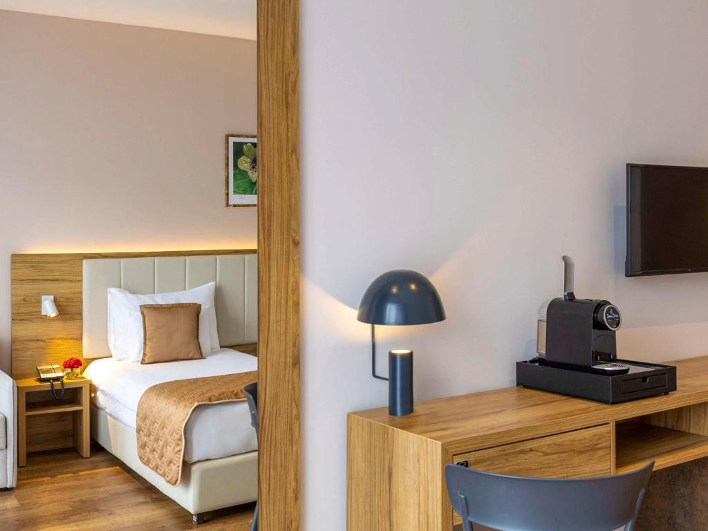 Voodi või voodid majutusasutuse Movenpick Resort and Spa Fruske Terme toas
