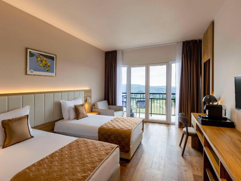 Voodi või voodid majutusasutuse Movenpick Resort and Spa Fruske Terme toas