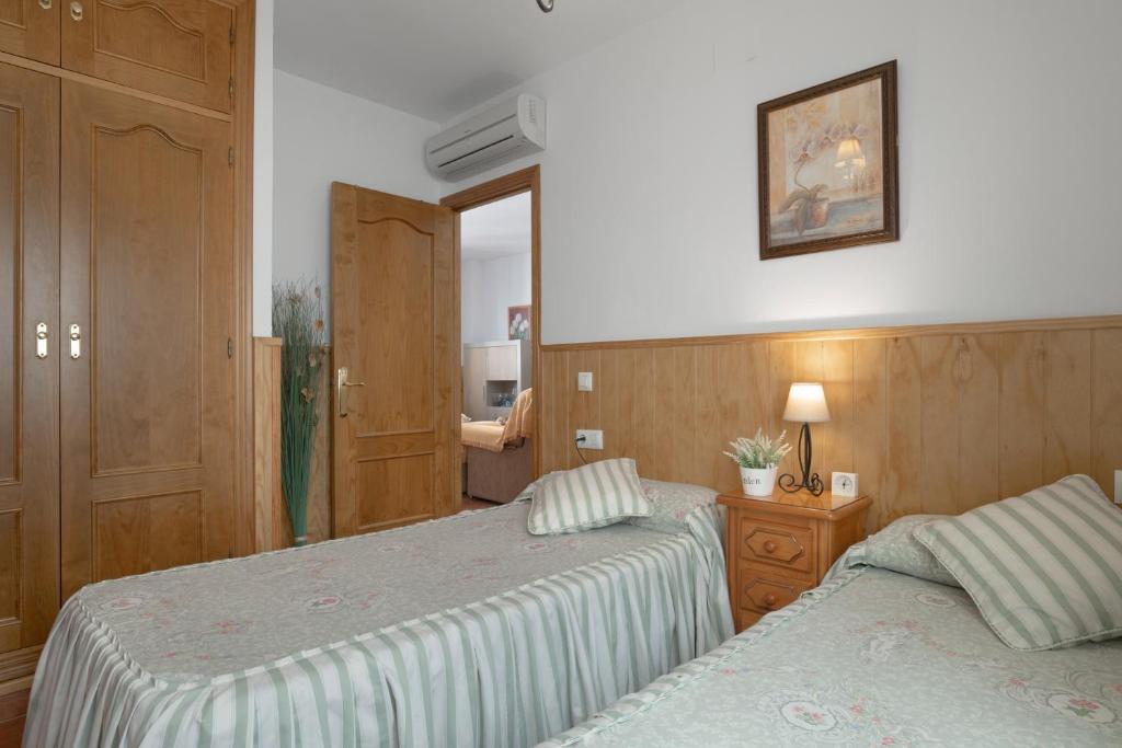 Postel nebo postele na pokoji v ubytování Apartamento Rocio - solo familias