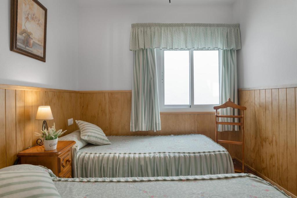Postel nebo postele na pokoji v ubytování Apartamento Rocio - solo familias