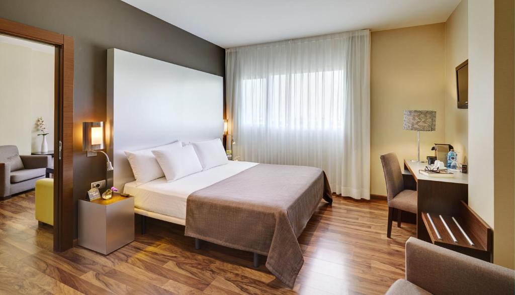 Postel nebo postele na pokoji v ubytování Sercotel JC1 Murcia