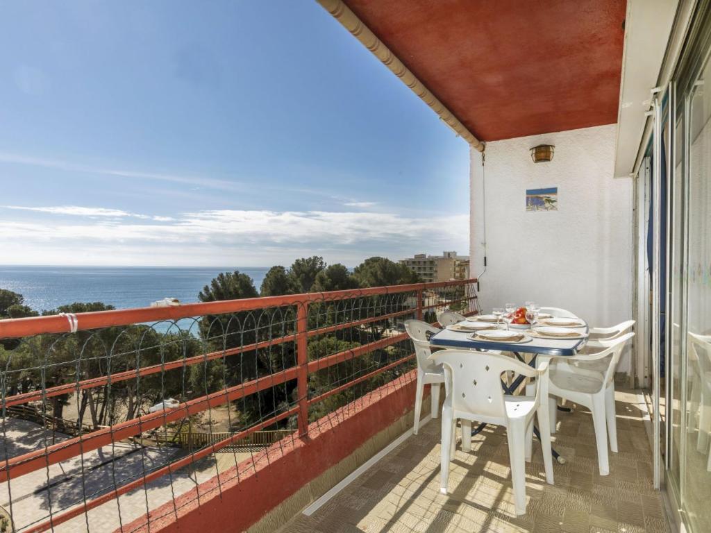 a balcony with a table and chairs and the ocean at Apartment Vaixell by Interhome in Miami Platja