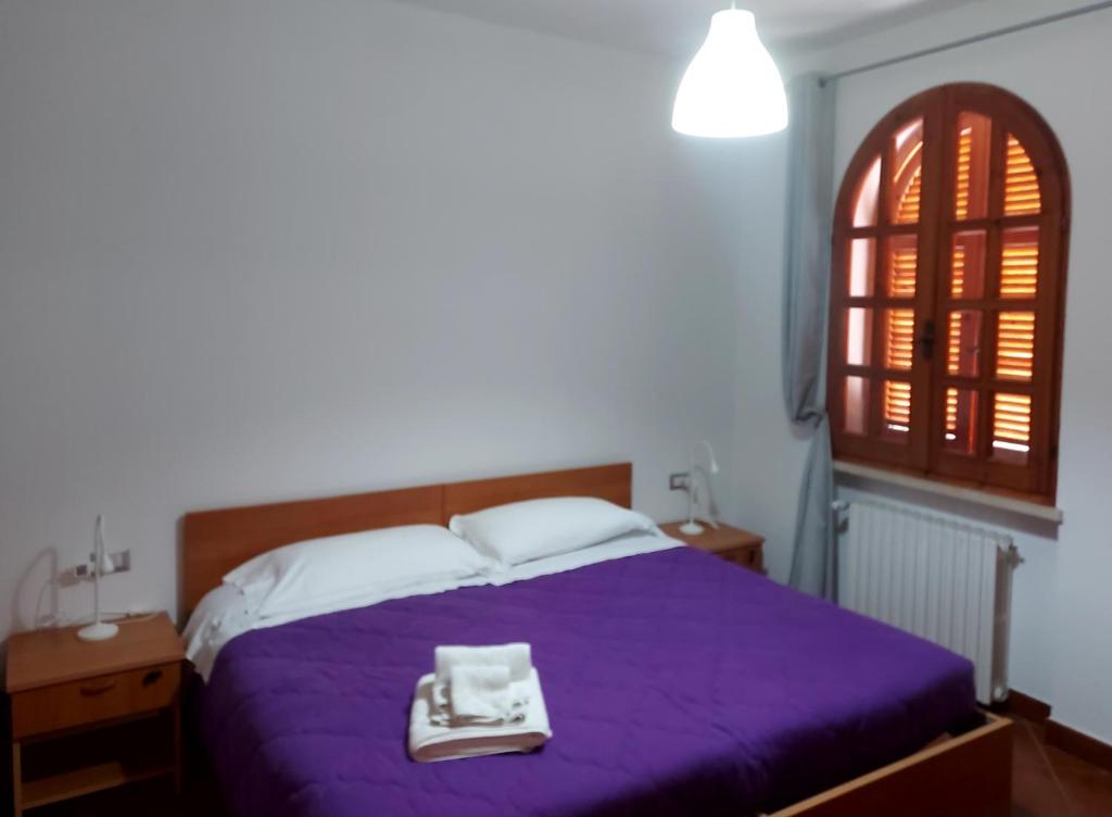 Postel nebo postele na pokoji v ubytování Villa Le Arcate