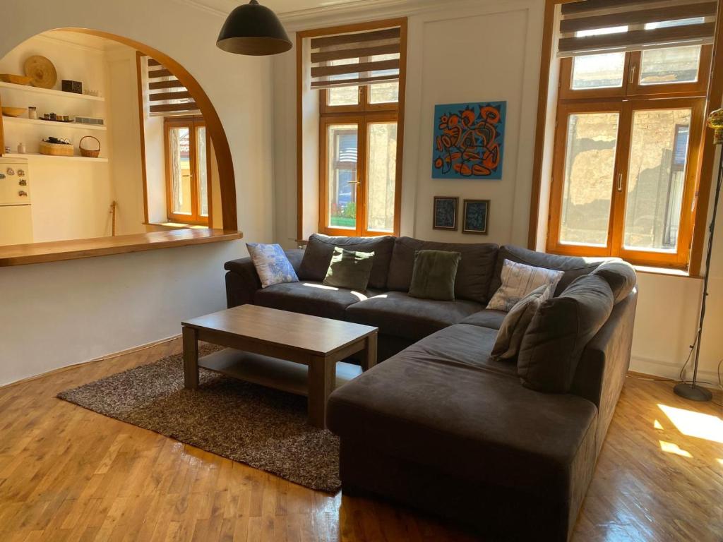 a living room with a couch and a coffee table at Rio Apartment Old Town Sarajevo in Sarajevo