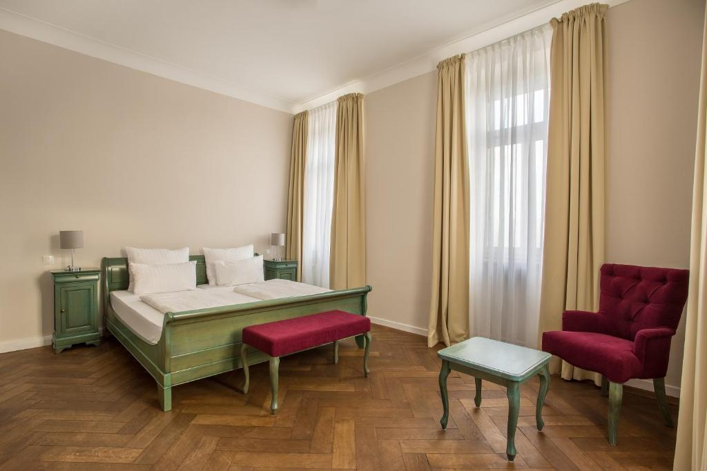 Postel nebo postele na pokoji v ubytování Hotel Annaberg