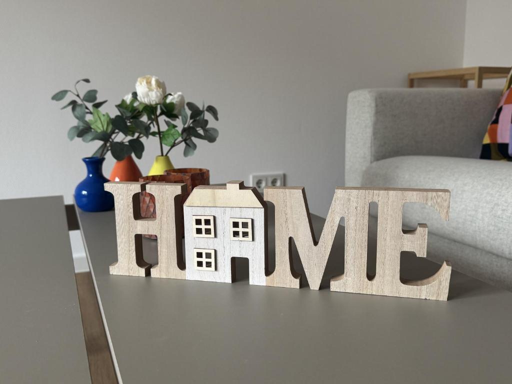 a wooden house cutout sitting on top of a table at Ferienwohnung Bea in Horn