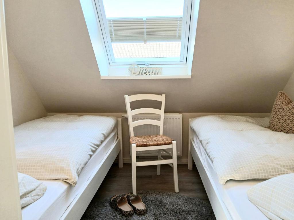 Postel nebo postele na pokoji v ubytování Haus Triton