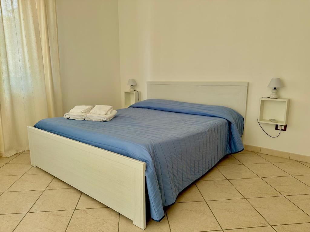 Postel nebo postele na pokoji v ubytování Appartamento Villa Circe