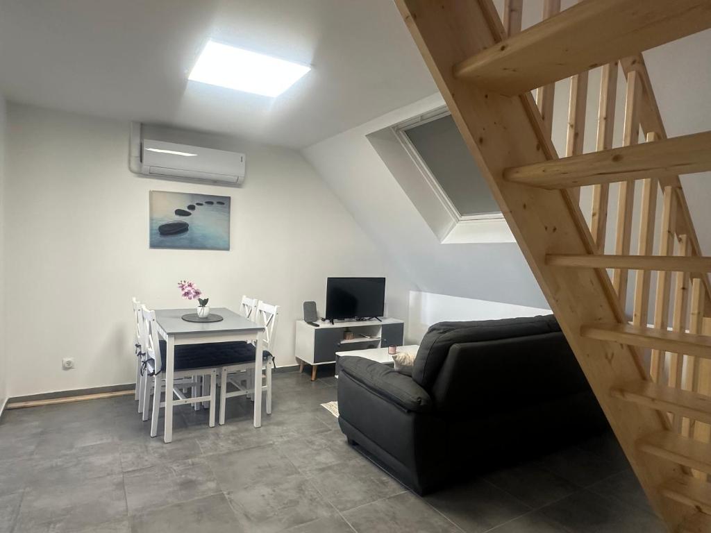 TV a/nebo společenská místnost v ubytování Appartement neuf cosy proche mer et Nausicaa