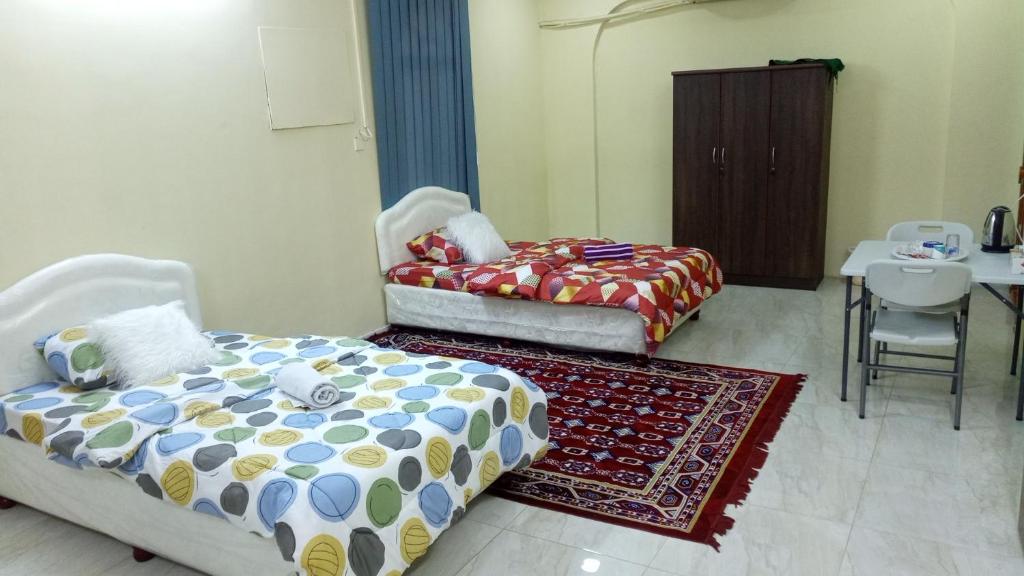 Postel nebo postele na pokoji v ubytování SALEM House Hostel Nizwa