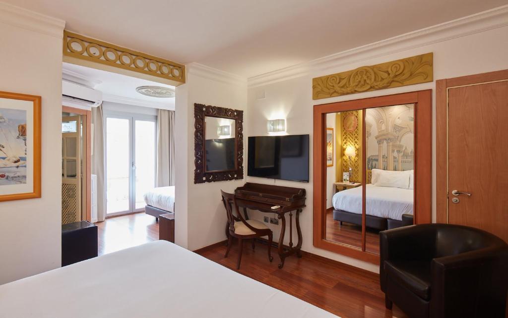 Posteľ alebo postele v izbe v ubytovaní Sercotel Hotel President