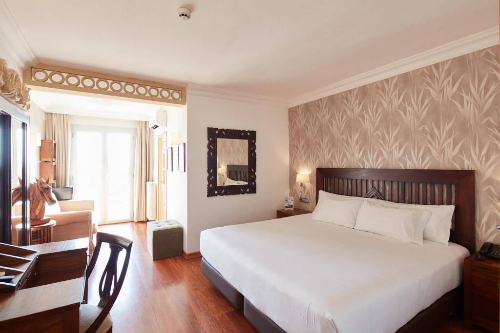 Posteľ alebo postele v izbe v ubytovaní Sercotel Hotel President