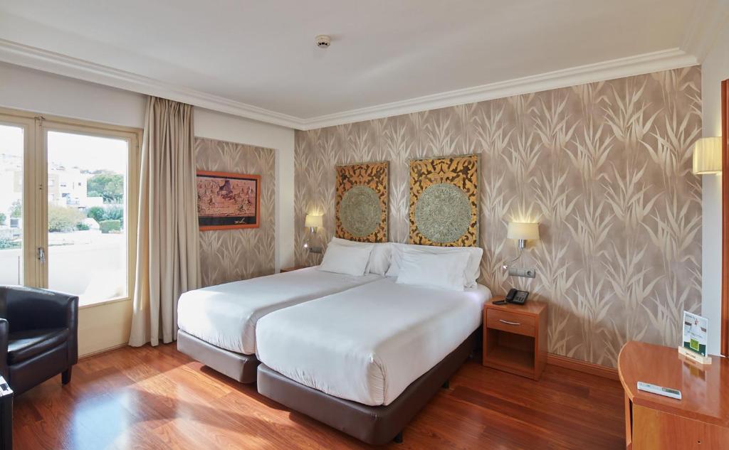 Posteľ alebo postele v izbe v ubytovaní Sercotel Hotel President
