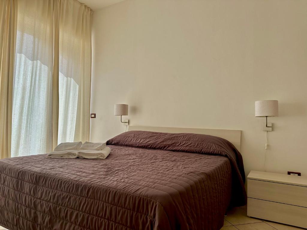 Postel nebo postele na pokoji v ubytování Appartamento Villa Circe