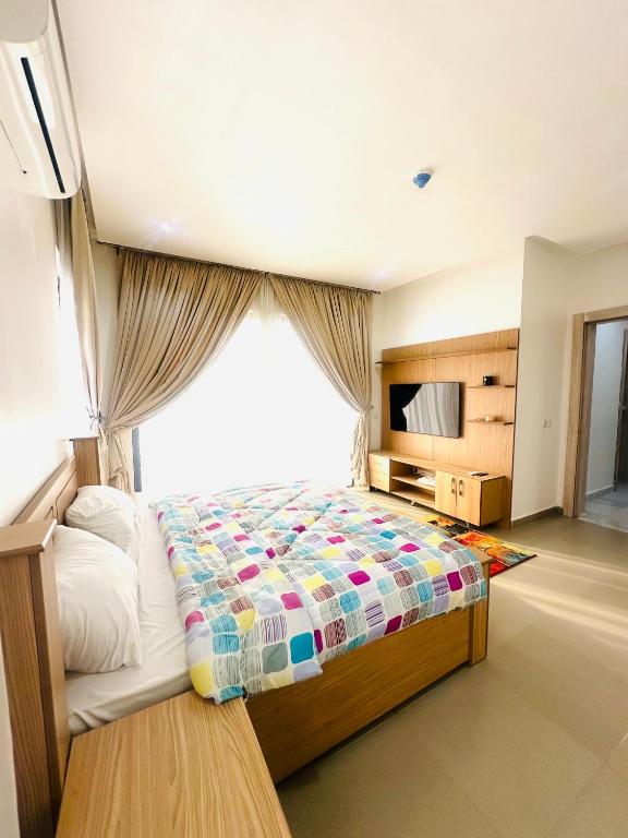 Postel nebo postele na pokoji v ubytování Joy luxury Apartments