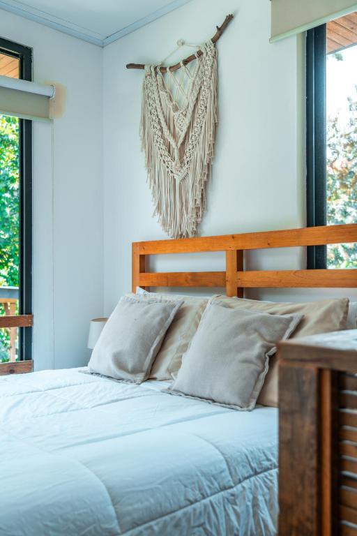 Postel nebo postele na pokoji v ubytování MALU Cabins