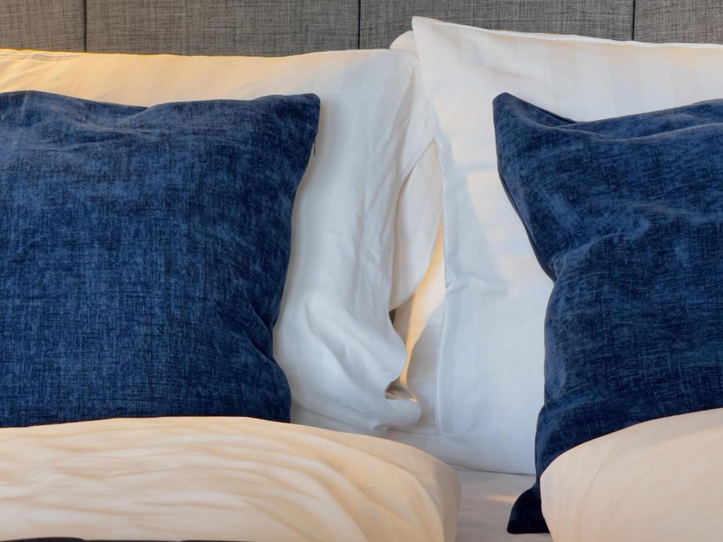 Postel nebo postele na pokoji v ubytování Injoy Premium Hotel Uppsala