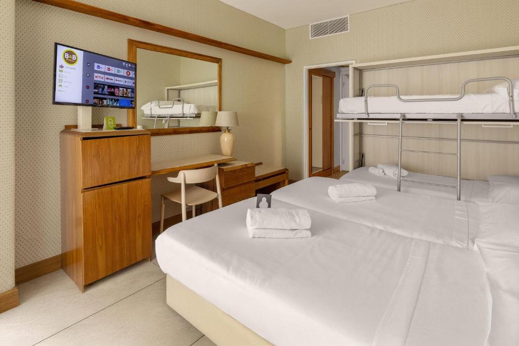 Postel nebo postele na pokoji v ubytování B&B Hotel Chioggia Airone